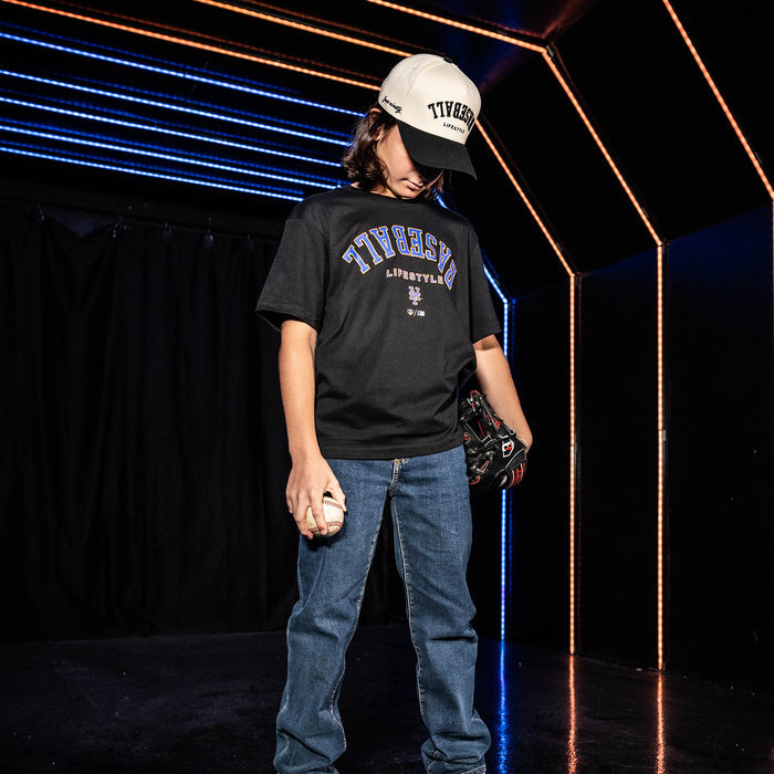Youth model wearing black youth graphic tee with "New York Mets Upside Down" design