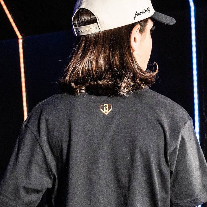 Youth model wearing black youth graphic tee with "New York Mets Upside Down" design