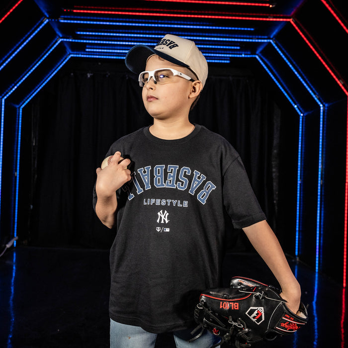 Youth model wearing black youth graphic tee with "New York Yankees Upside Down" design