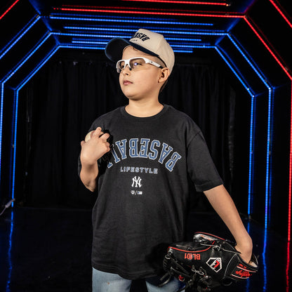 Youth model wearing black youth graphic tee with "New York Yankees Upside Down" design