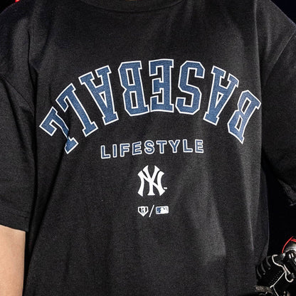 Youth model wearing black youth graphic tee with "New York Yankees Upside Down" design