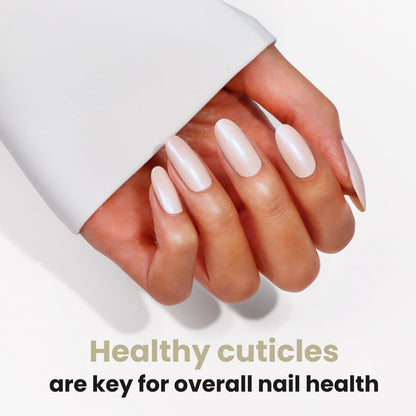 A hand with long, white, glossy nails is displayed, emphasizing the significance of healthy cuticles for overall nail health. Elevate your routine with LONDONTOWN's Nourishing Cuticle Oil to support nail restoration and keep that ideal shine.