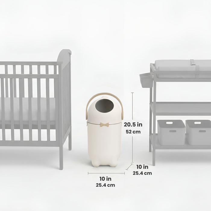 iTouchless Odor-Free Diaper Pail shown centered between a crib and a changing table, with labeled dimensions. The pail measures 20.5 inches tall (52 cm) and 10 inches wide and deep (25.4 cm), illustrating its compact size and nursery-friendly fit.
