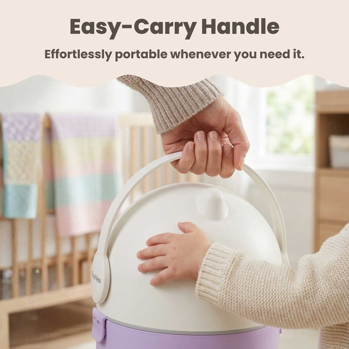 Close-up of a person using the easy-carry handle to lift the iTouchless Odorless Diaper Pail in Pastel Orchid. A baby's hand is visible touching the pail in a nursery setting, emphasizing the product's effortless portability and child-friendly design.