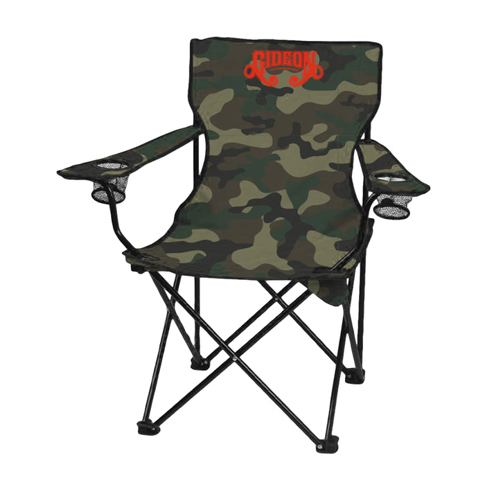 The Gideon foldable camping chair features a camo pattern, black metal frame, two armrests with cup holders, and a bold GideonOrange “GIDEON” logo on the backrest. Ideal as a sturdy outdoor folding chair for any adventure.