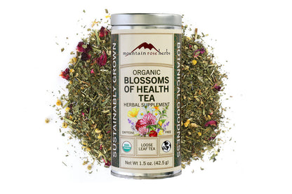Mountain Rose Herbs Organic Blossoms of Health Tea canister with tea leaves and flowers on a white background, Raven's Cauldron, 6 N. Sandusky St, Delaware, OH 43015