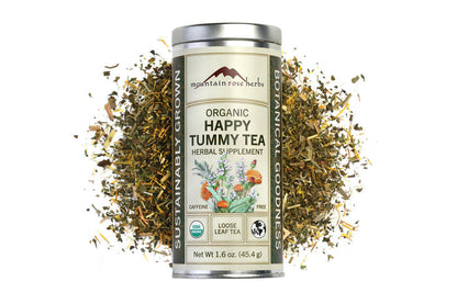 Canister of Organic Happy Tummy Tea with dried herbs on a white background, Raven's Cauldron, 6 N. Sandusky St, Delaware, OH 43015