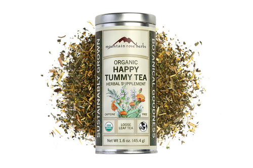Canister of Organic Happy Tummy Tea with dried herbs on a white background, Raven's Cauldron, 6 N. Sandusky St, Delaware, OH 43015