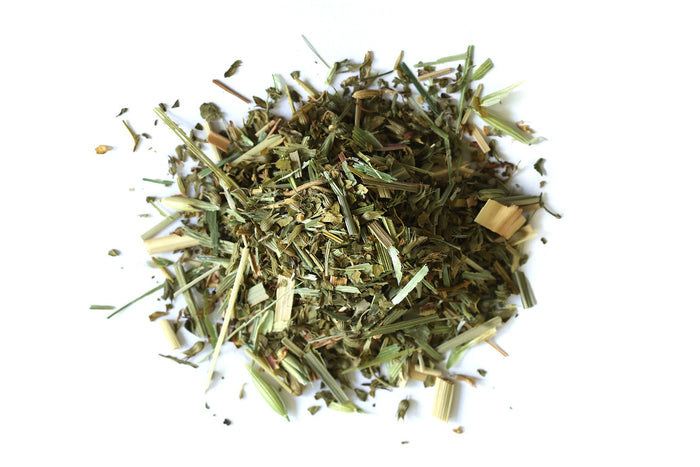 Organic Happy Tummy Tea with dried herbs on a white background, Raven's Cauldron, 6 N. Sandusky St, Delaware, OH 43015