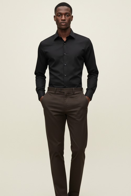 Full length model wearing Verso Black Dress Shirt and Khaki Dark Brown Pants on cream background