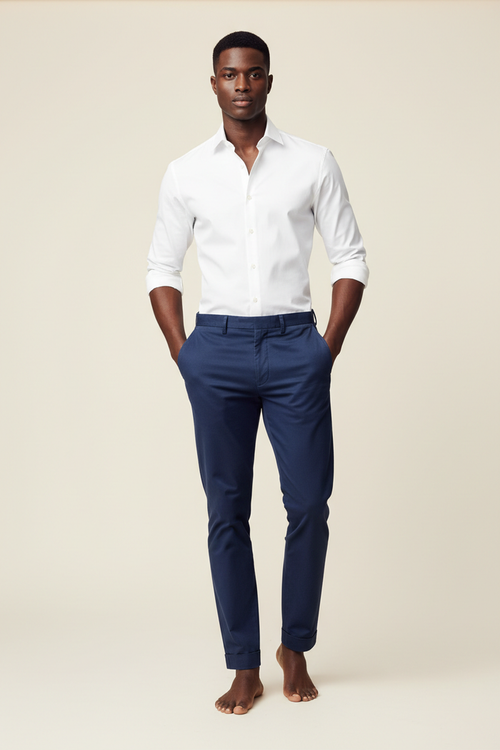 Full length model wearing Verso White Dress Shirt and Khaki Navy Blue Pants on cream background