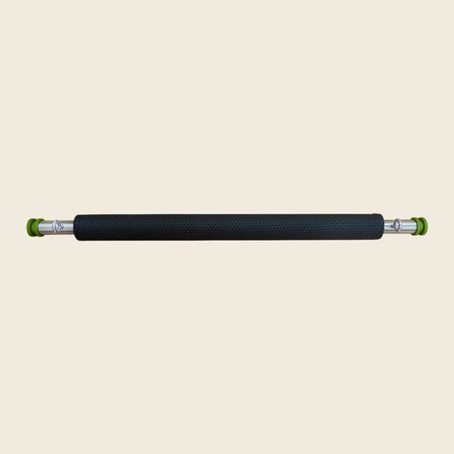 Black textured padded cover fitted over a Pilates guillotine tower rod with green end caps.