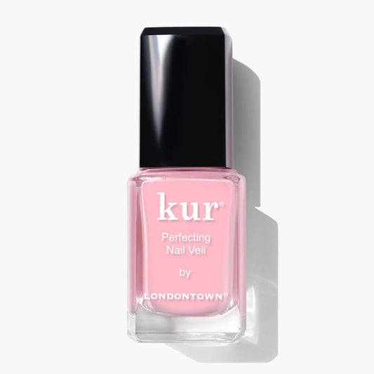 A bottle of LONDONTOWN Perfecting Nail Veil #7 in pink, with a power-packed formula, featuring a black cap and white text on the label, set against a white background.