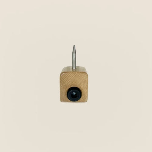 Wooden gear stopper with metal pin and rubber bumper for Gratz Pilates reformer.