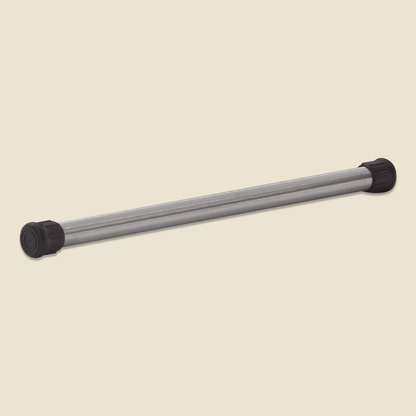 Weighted stainless steel Pilates pole with black rubber end caps on beige background.