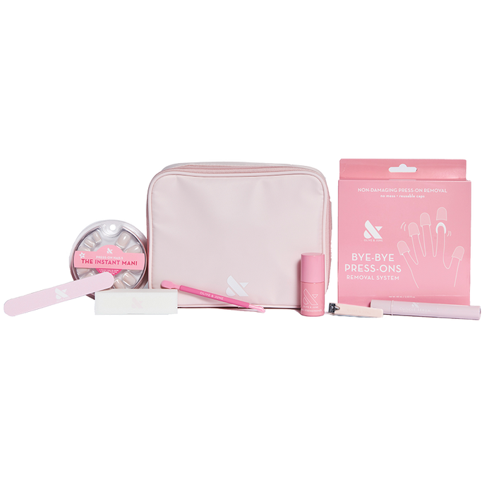 Press-On System - 4 Sets displayed with pink pouch, nail file, remover kit, brush, and nail polish for easy at-home mani care