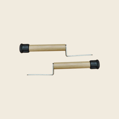 Pair of wooden raised insert handles with metal insert prongs for Pilates low mats.