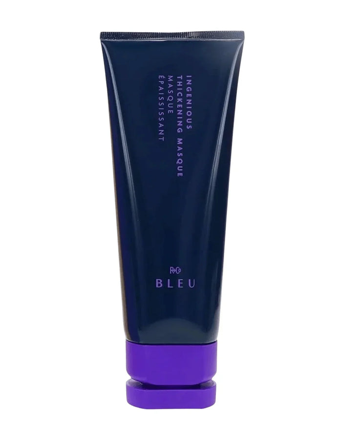 R+Co Bleu Ingenious Thickening hair mask in a dark blue tube with purple cap, 5 oz
