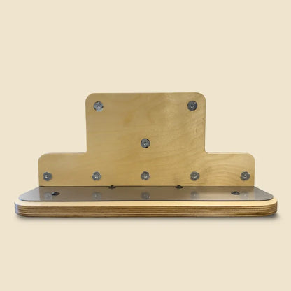 Wooden Reformer standing platform with metal fasteners and upright T-shaped birch backboard.