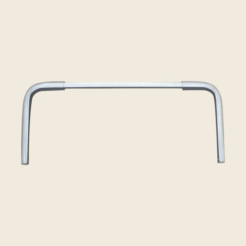 Aluminum replacement foot bar support for a Gratz Pilates Reformer on a beige background.