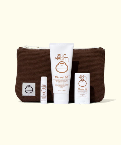 Sun Bum Road Tripper - Mineral sunscreen set with SPF 30 lotion, SPF 50 stick, lip balm, and brown zip pouch.
