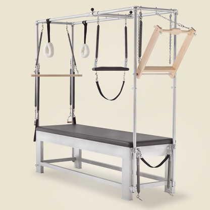 Roll down bar with springs mounted atop a classic aluminum Cadillac Pilates apparatus.