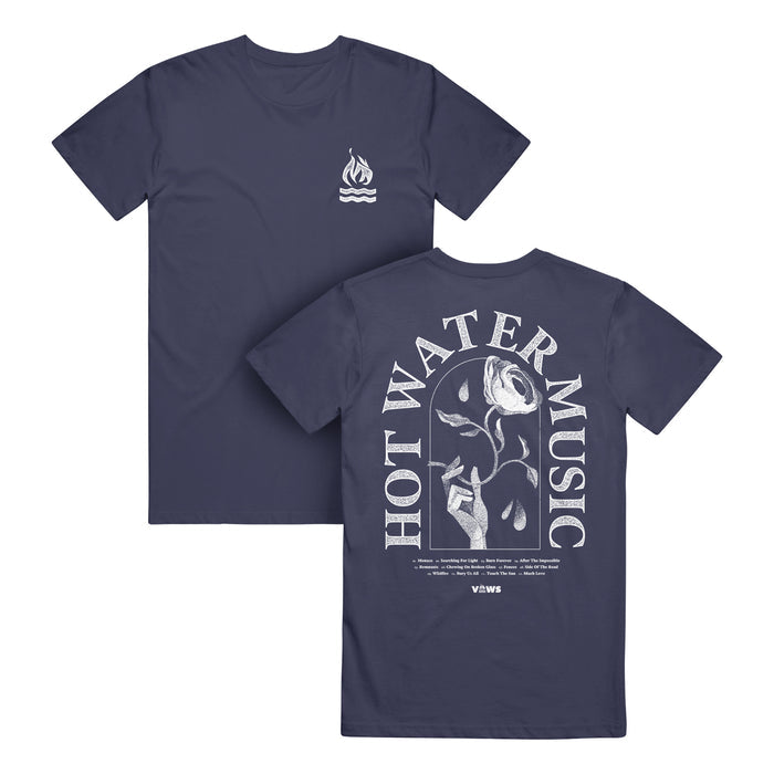 Hot Water Music navy Comfort Colors T-Shirt made of soft ring-spun cotton; features a small flame and wave logo on the chest and a large back graphic of a hand holding a wilting rose dripping water with HOT WATER MUSIC text.
