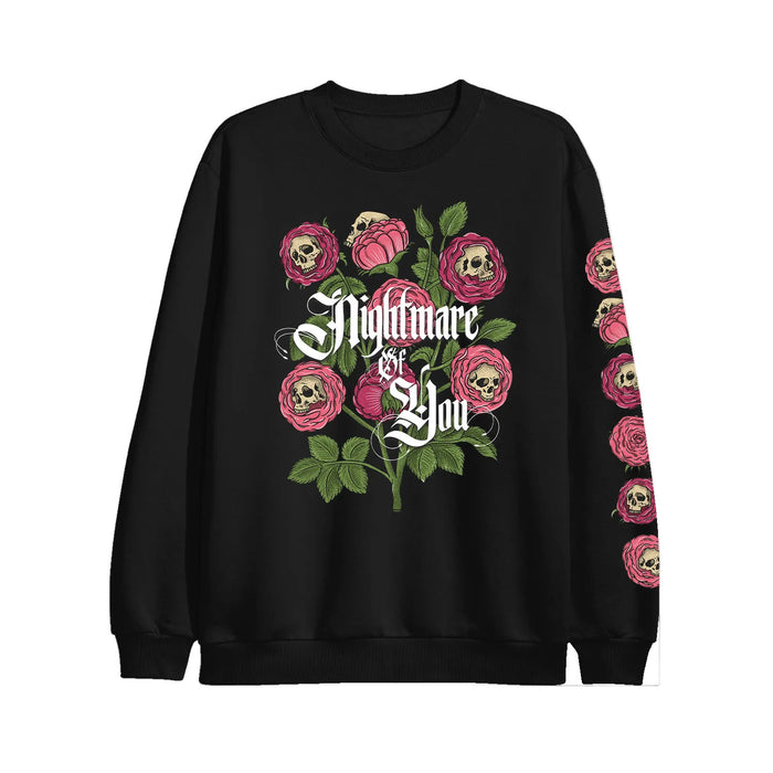 Nightmare Of You black crewneck sweatshirt with printed pink roses featuring skull centers and green leaves. "Nightmare of You" is in ornate white across the chest; rose and skull motifs also adorn the left sleeve.