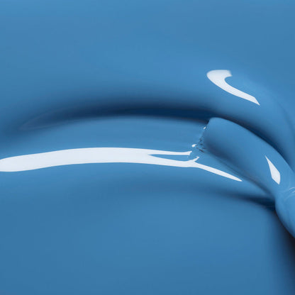 Close-up of glossy Manucurist Saphir gel polish featuring smooth, curved ridges and reflective highlights for an abstract, fluid look.