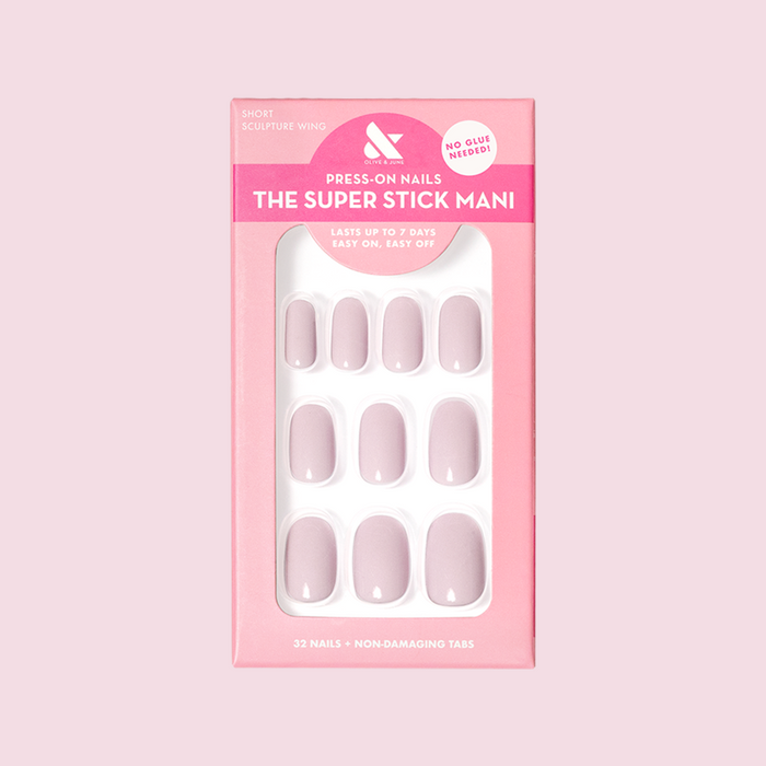 Pack of Sculpture Wing | Short | Round - Tab Press-On nails in cool lavender neutral shade with easy peel tabs on pink box background