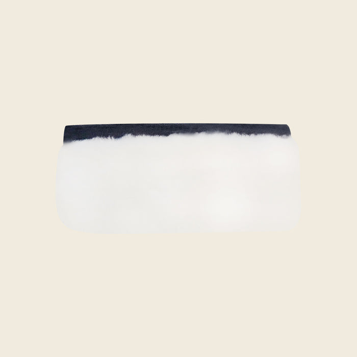 Genuine white shearling sheepskin cover for reformer handles, a soft-grip Pilates accessory.