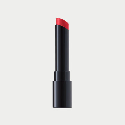 Black lipstick with red cap on a light gray background