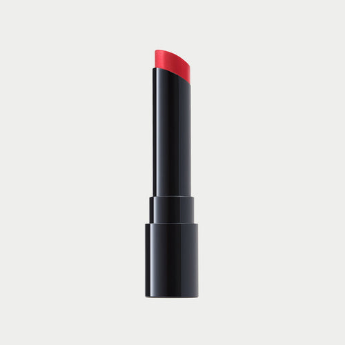 Black lipstick with red cap on a light gray background