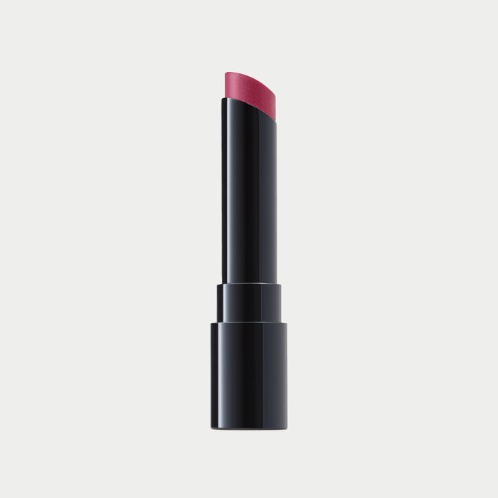 Lipstick with black casing and pink shade on a light gray background