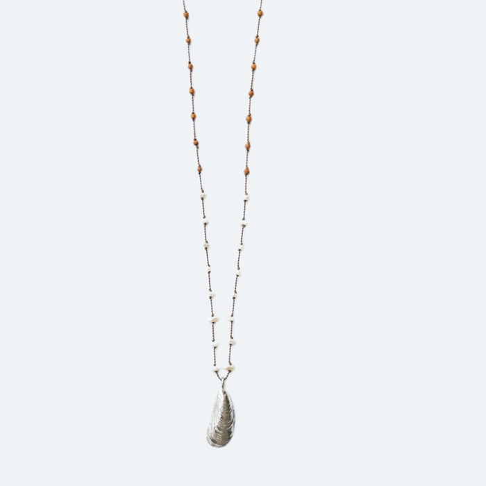 Beaded shell pendant necklace with wood beads and white accents