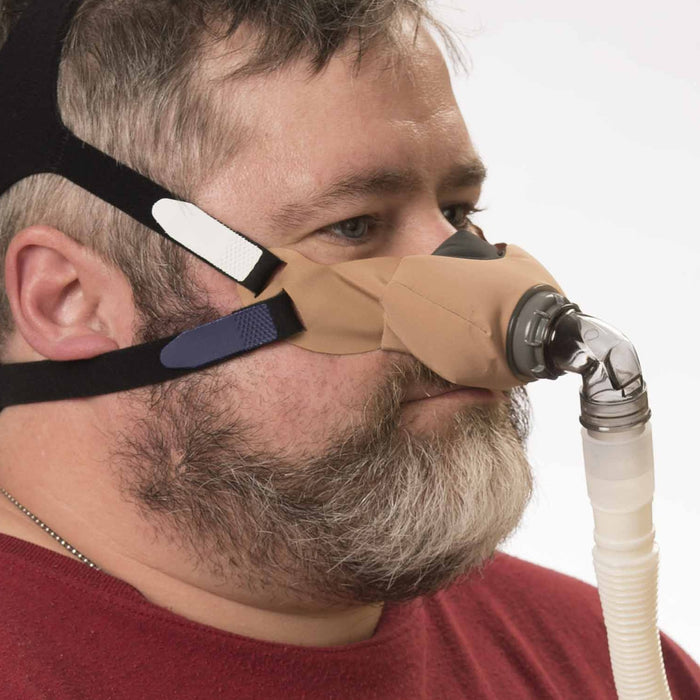 Man Wearing a beige Sleepweaver Elan Mask