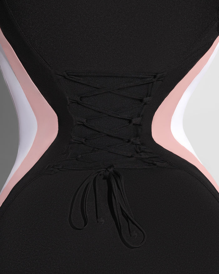Close up of back lacing on Sleeveless Surfy Boy Shortie - Contour Black/Rose/White