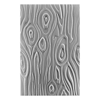Spellbinders - 3D Embossing Folder - Knock On Wood. This has an intense wood grain designs. Texturize a surface of various card sizes from A2 to a Slimline. For detailed impression, lightly mist the cardstock on both sides with water before embossing. Available at Embellish Away located in Bowmanville Ontario Canada