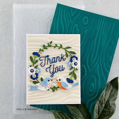 Spellbinders - 3D Embossing Folder - Knock On Wood. This has an intense wood grain designs. Texturize a surface of various card sizes from A2 to a Slimline. For detailed impression, lightly mist the cardstock on both sides with water before embossing. Available at Embellish Away located in Bowmanville Ontario Canada Card example by brand ambassador.