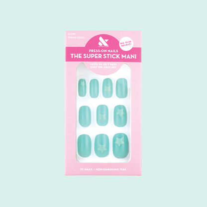 Spring Stars | Short | Squoval - Tab Press-On nails in pastel mint with turquoise star accents in packaging on light background