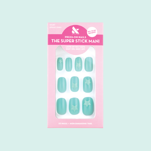Spring Stars | Short | Squoval - Tab Press-On nails in pastel mint with turquoise star accents in packaging on light background