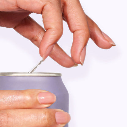 A hand opens the pull tab on a light purple aluminum can against a plain, light background—sorry, but the product description appears to only contain formatting code and no actual product details. Please provide a clear product description for LONDONTOWN Strengthening Nail Cream so I can extract SEO keywords for you.