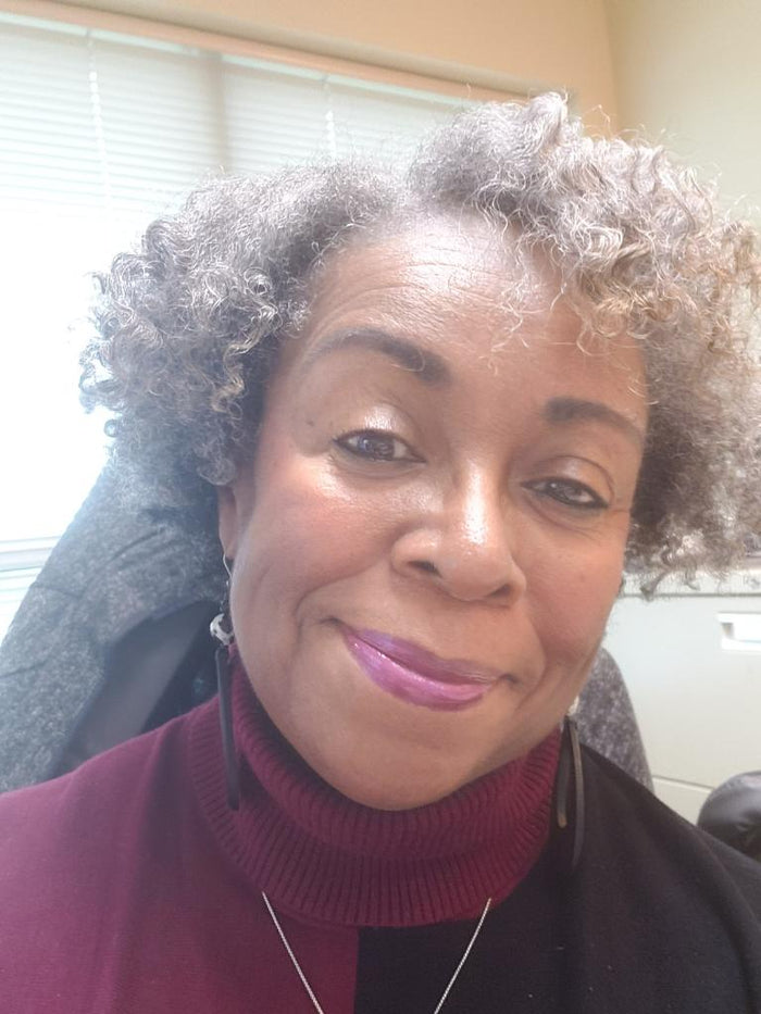 Customer wearing Lust lipgloss