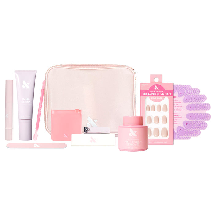 Tab Press-On System - 4 Sets with manicure tools, press-on nails, nail polish remover, and pink carrying case on white background