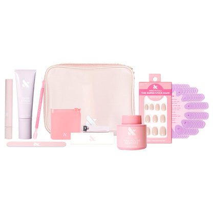Tab Press-On System - 4 Sets with manicure tools, press-on nails, nail polish remover, and pink carrying case on white background