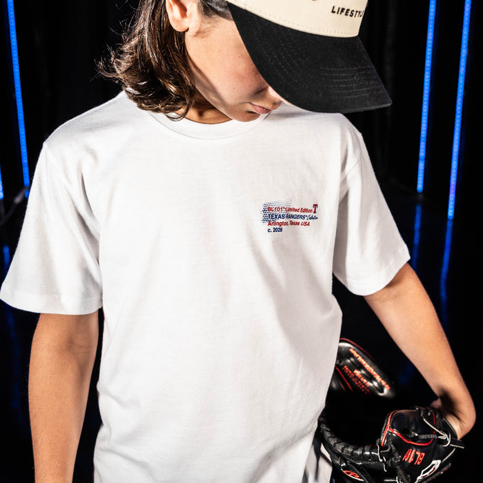Youth model wearing white youth graphic tee with "Texas Rangers Drip" design