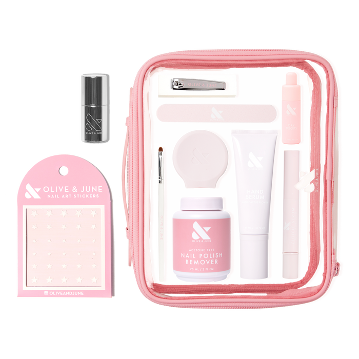 The Mani Weekender - 1 Polish kit with nail polish remover, hand serum, nail clipper, stickers, and tools in pink pouch