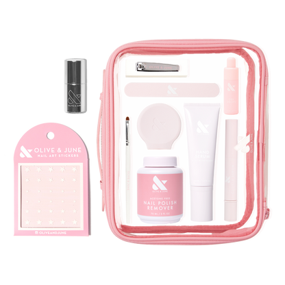 The Mani Weekender - 1 Polish kit with nail polish remover, hand serum, nail clipper, stickers, and tools in pink pouch