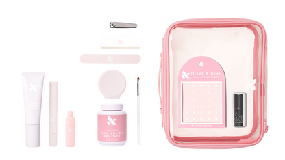 The Mani Weekender - 1 Polish kit with nail polish remover, hand serum, nail file, stickers, and tools in a clear pink pouch