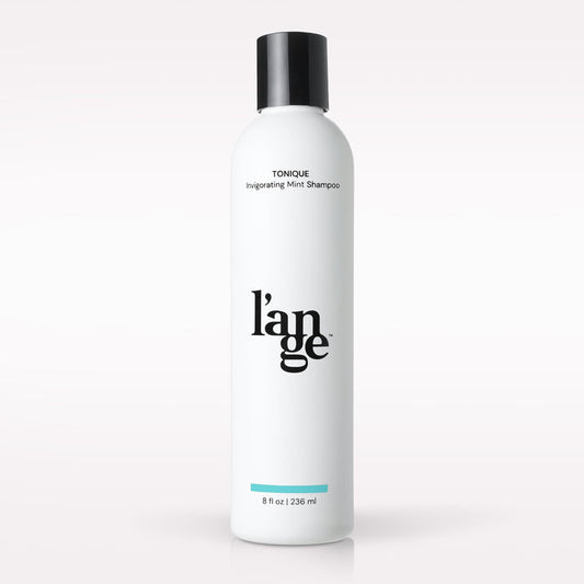L’ange Tonique Invigorating Mint Shampoo on a blank background